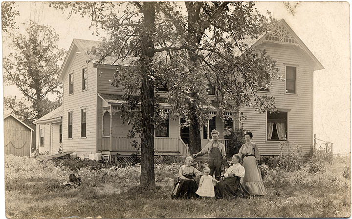 Mathews' house and family with the Hurelle's on photo post card