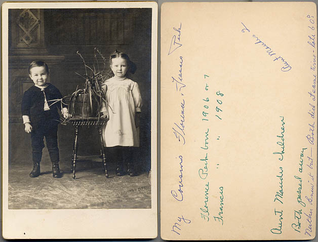 In a studio portrait, Maude Hurelle's kids, Florence and Francis stand still as a potted plant.