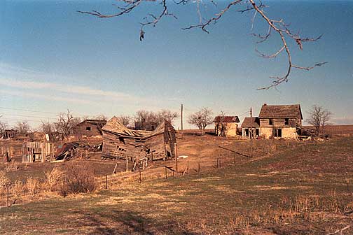 crumbling barn and unmended fences